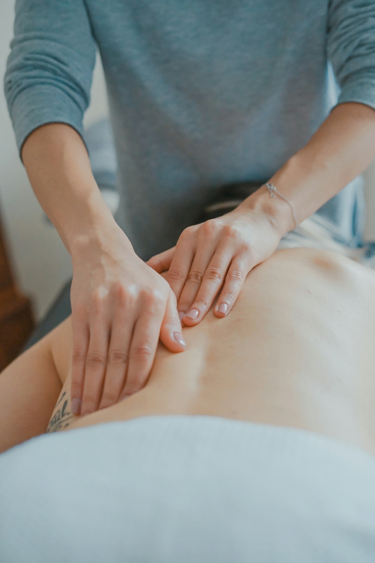 A therapist's hands during a relaxing treatment